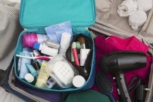 Women's Toiletry Travel Bag in Packed Suitcase
